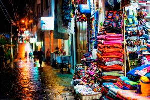 shutterstock_570045064-Storefronts-and-wet-sidewalk-in-Aguas-Calientes,-Peru